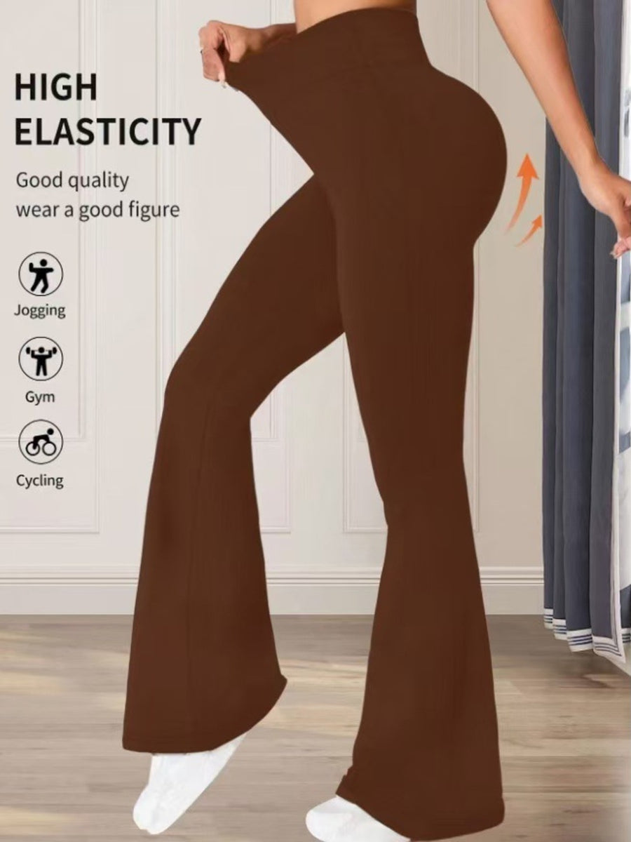 Premium high waist flare pants in brown cotton, showing high elasticity and a flattering fit.