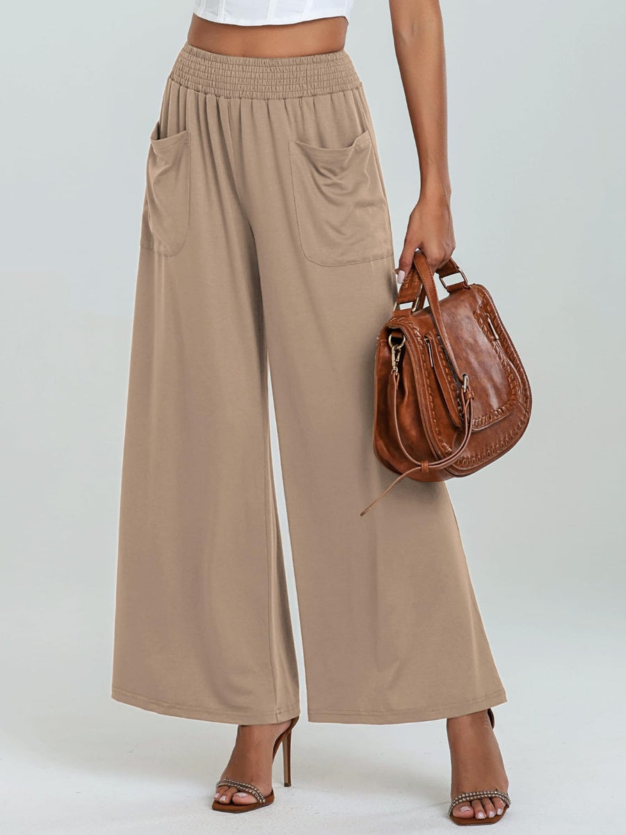Tan elastic waist palazzo trousers with pockets and wide legs.