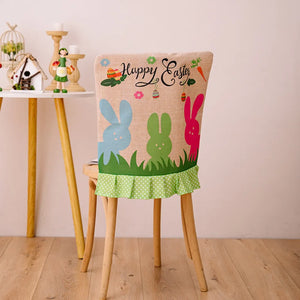 Easter chair cover with bunnies, grass, and Happy Easter text, ruffled polka dot trim
