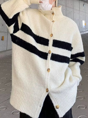 Full-size striped knit button-down cardigan in cream with black diagonal stripes and a mock neck.