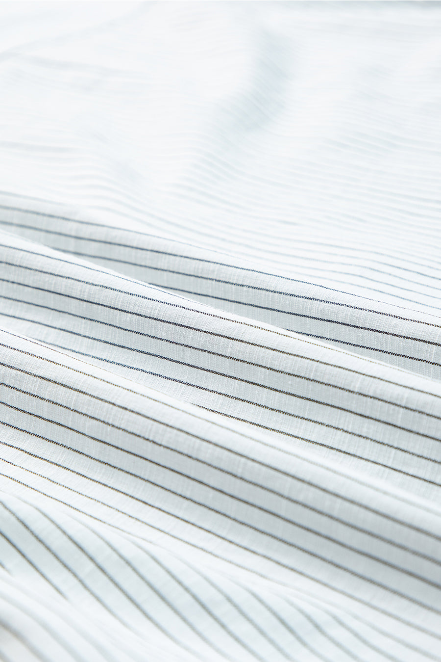White button-down shirt with subtle pinstripe texture