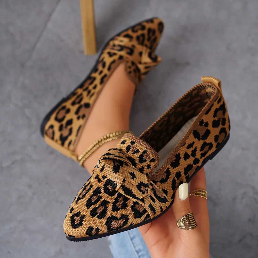 Knot detail knit leopard flats with pointed toe and comfortable slip-on style.