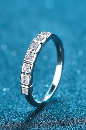 Silver band ring with square cut diamonds set in a row