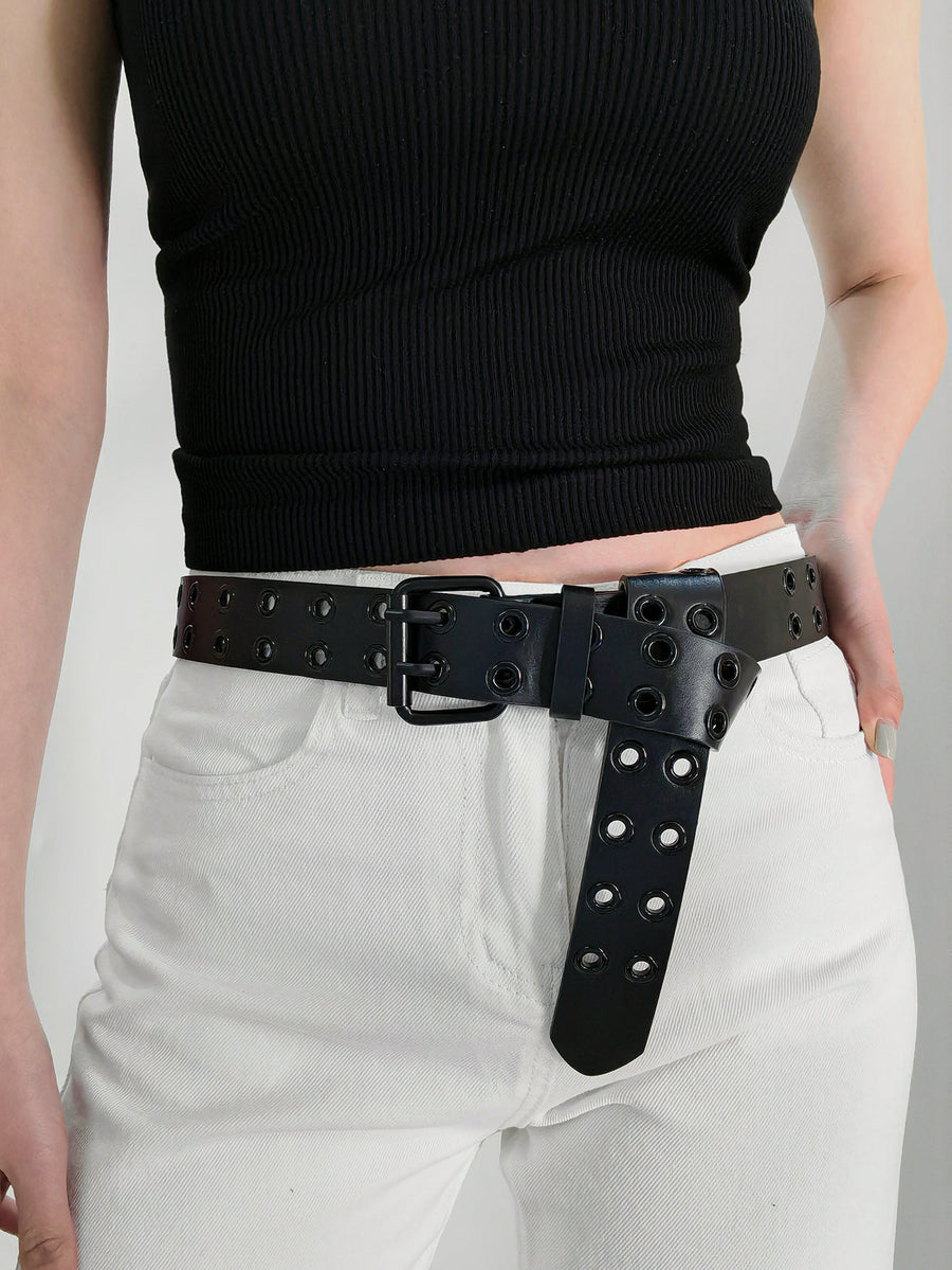 Black vegan leather belt with double grommets and silver buckle.