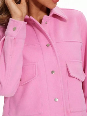Pink long-sleeve trucker jacket with snap buttons and chest pockets