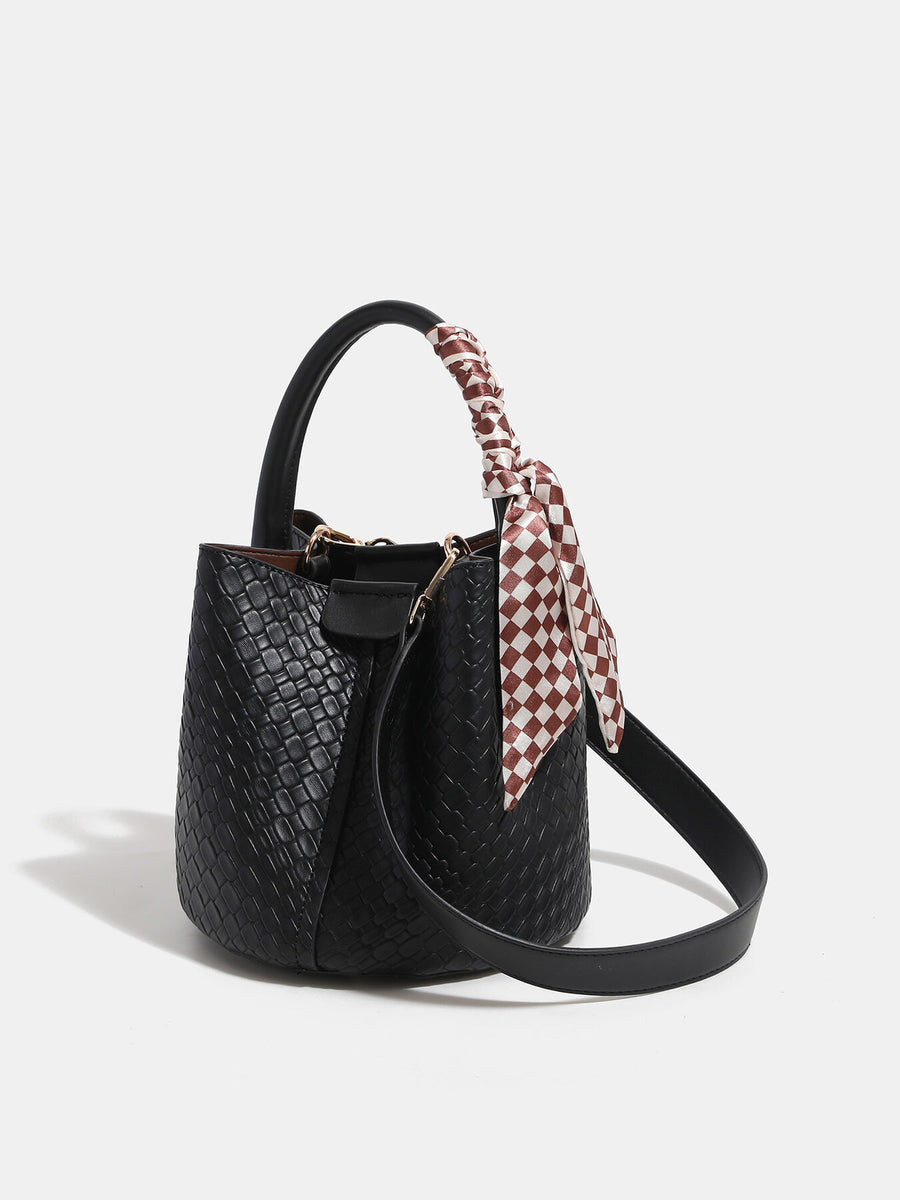 handbag in black with woven and woven texture