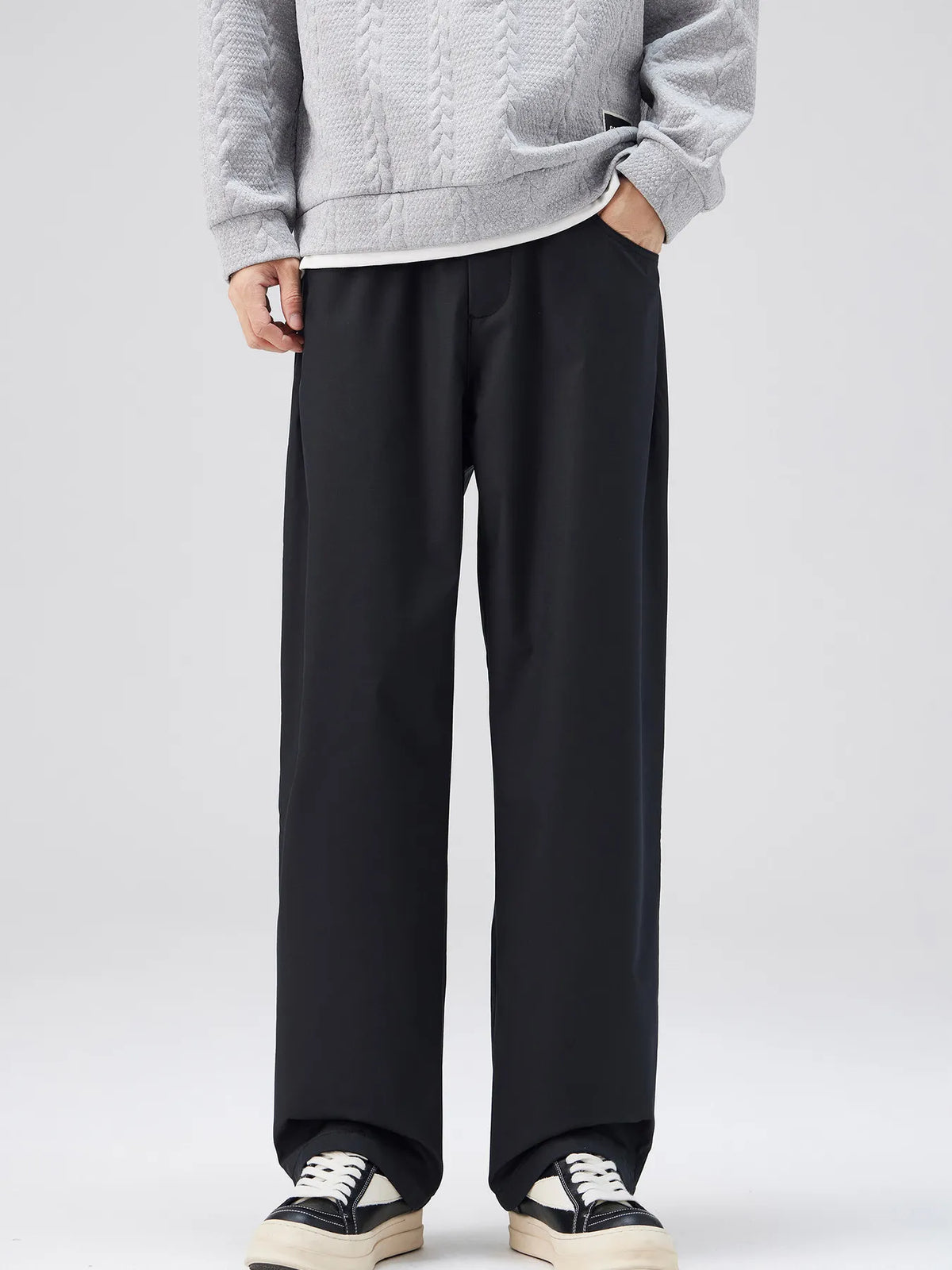 Black oversized casual loose fit pants with a cotton blend, styled with a grey sweater.