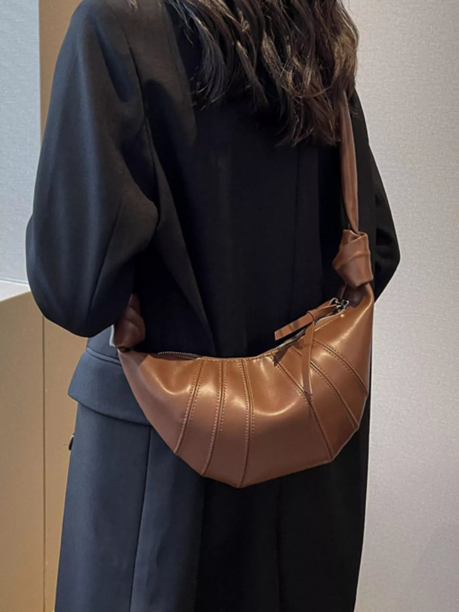 Chic Crescent Hobo Crossbody Bag in brown with stitched panel detail and knotted strap.