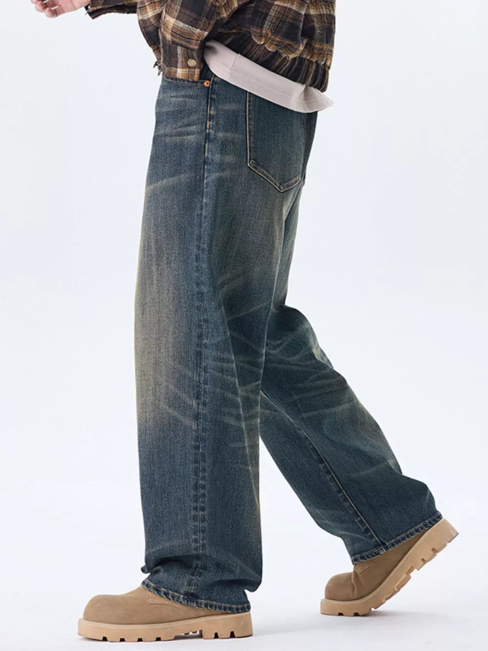 Men's relaxed fit wide-leg jeans in washed blue denim with a worn look.