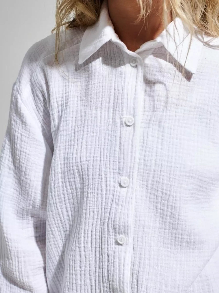 100% cotton Care instructions: Machine wash cold button-down shirt in Light Green with relaxed silhouette