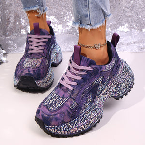 Purple rhinestone high-heel platform sneakers with tie-dye effect and chunky sole.