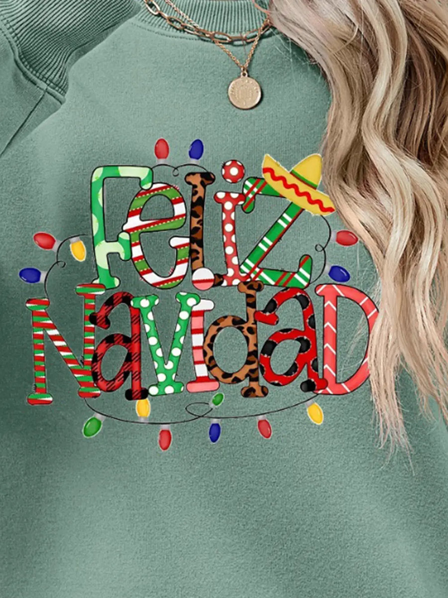 Sage Feliz Navidad graphic sweatshirt with festive lights and sombrero detail.