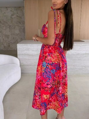 Floral tie-strap midi dress in red with a vibrant floral print and A-line skirt.