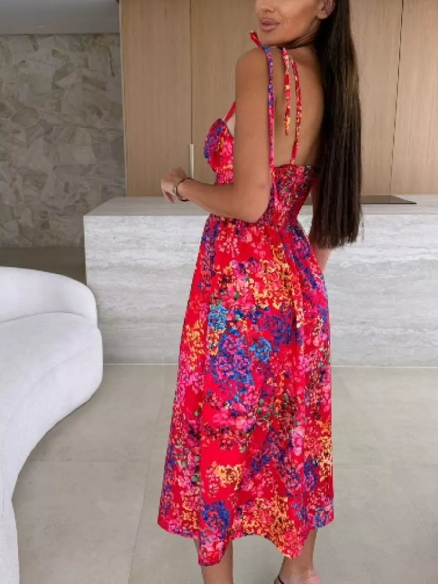 Floral tie-strap midi dress in red with a vibrant floral print and A-line skirt.