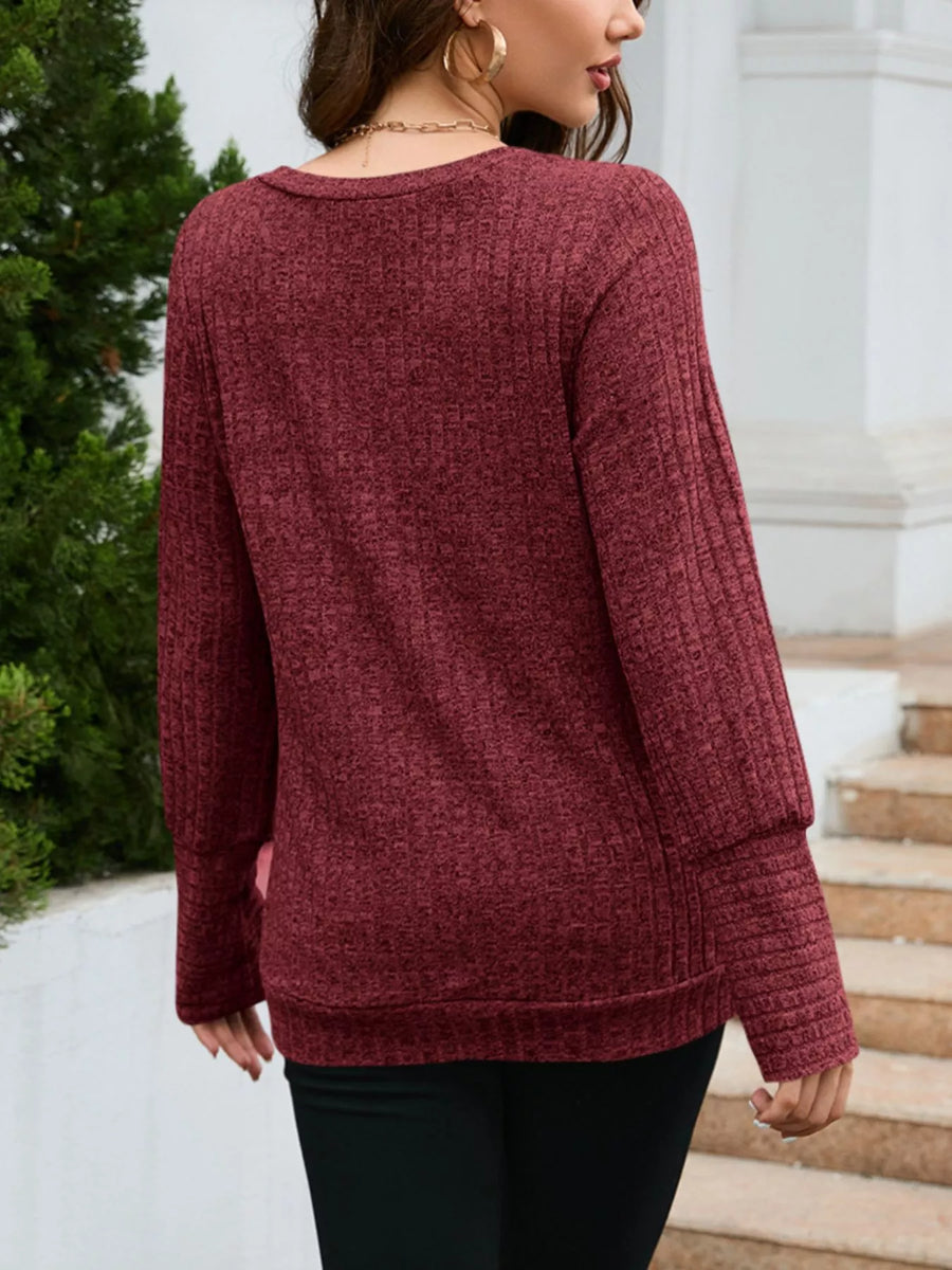 Red textured V-neck knit long-sleeve sweater with ribbed cuffs and hem