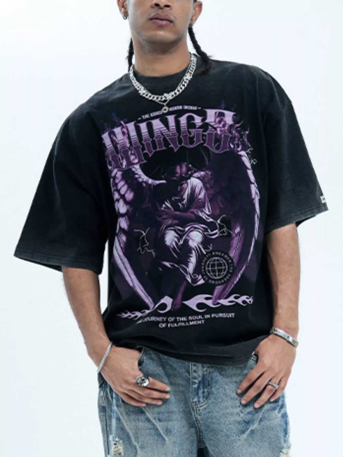 Oversized black graphic tee with purple angel design and text, cotton blend.