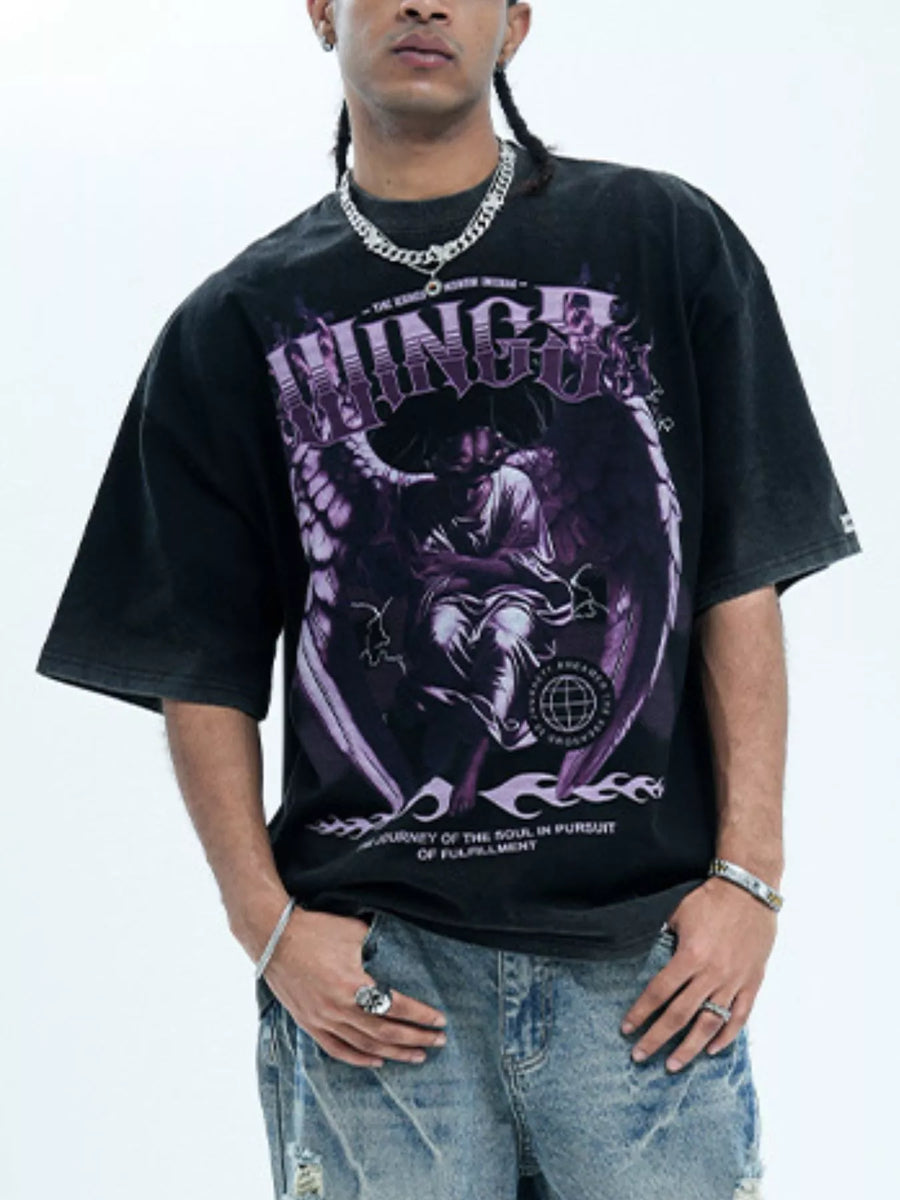 Oversized black graphic tee with purple angel design and text, cotton blend.