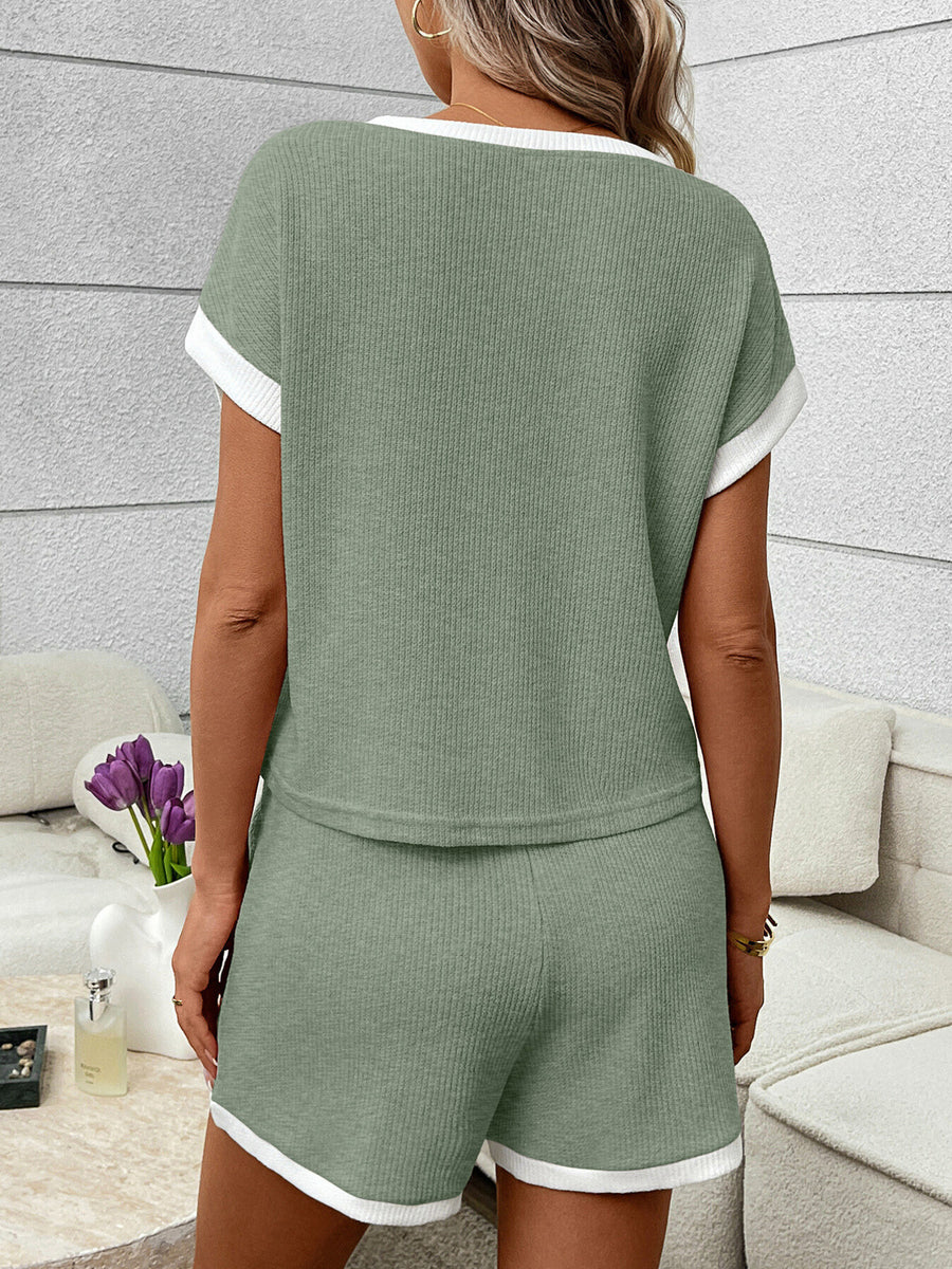 Sage ribbed knit two-piece set with white trim, short sleeve top and shorts.