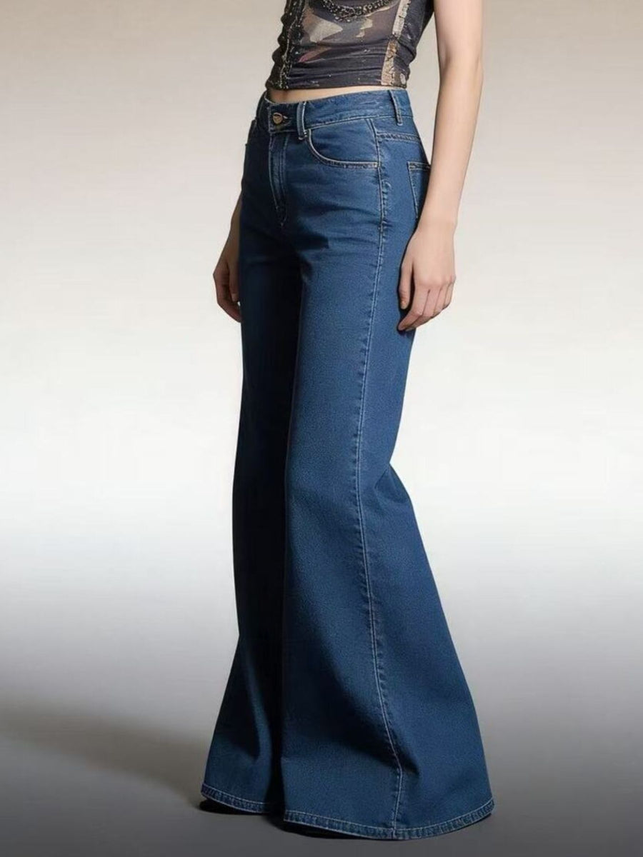 Maternity flare jeans in dark wash denim with a high waist and dramatic bell bottoms.