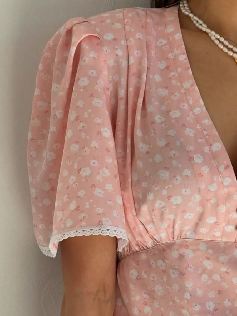 Pink floral puff sleeve dress with lace trim and V-neckline