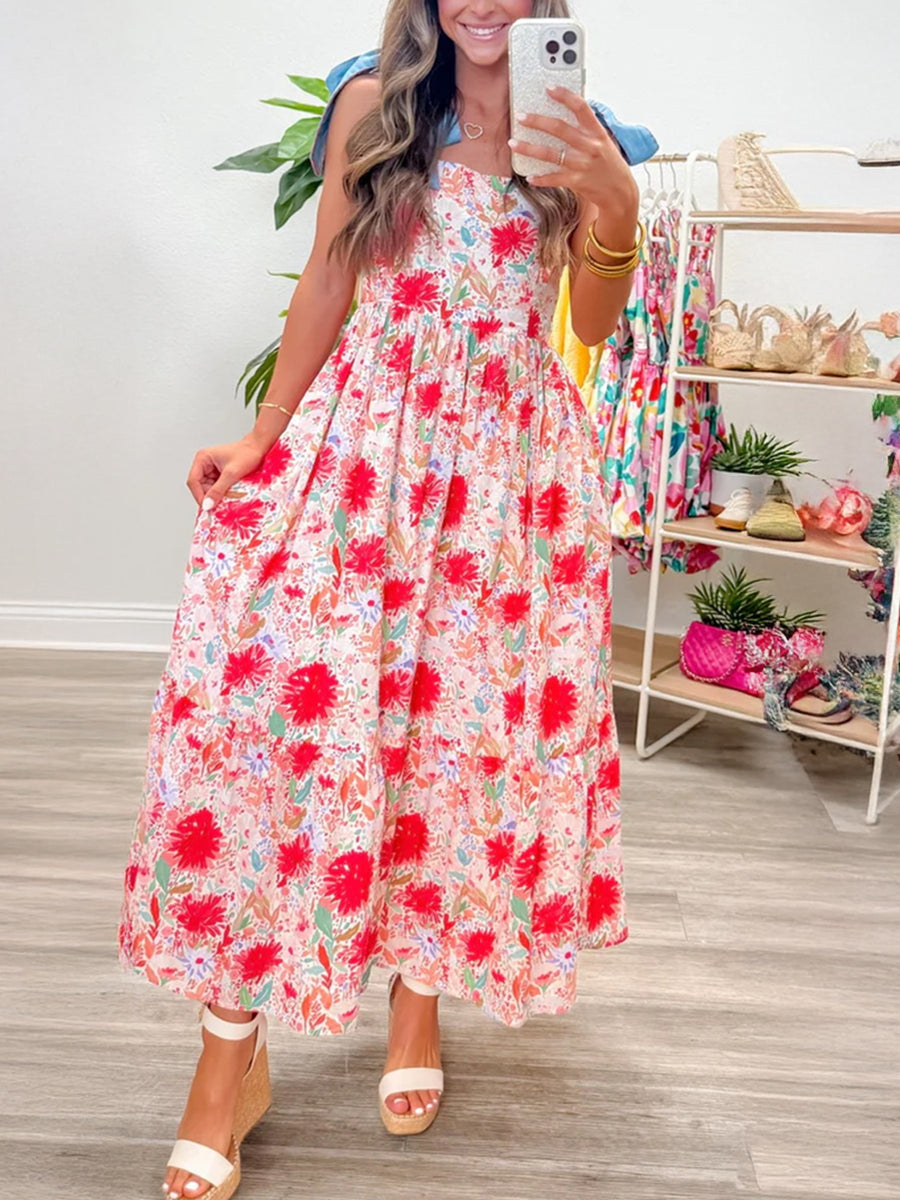 Floral print midi dress with tie shoulders and tiered skirt.