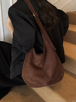 Large brown suede hobo shoulder bag with adjustable strap and gold buckle detail.