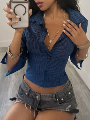 Blue button-up shirt featuring buttoned and striped