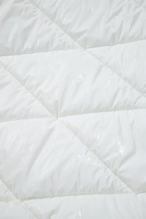 White glossy quilted puffer jacket detail with diamond stitching.