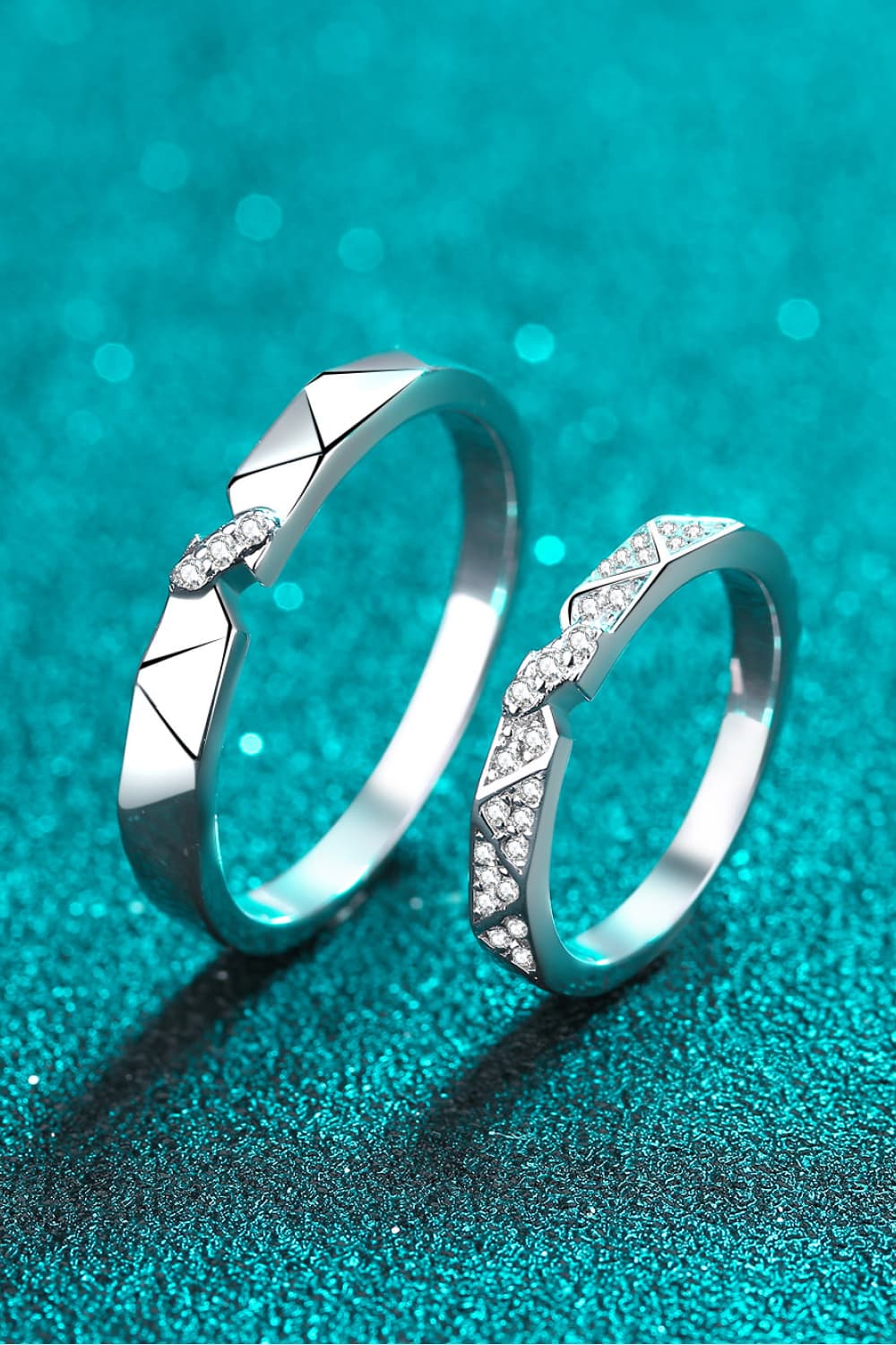 Geometric rhodium pavé ring set with cubic zirconia accents.