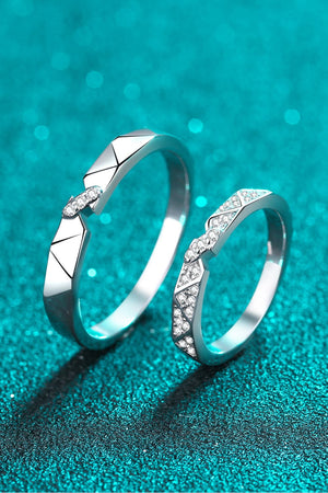 Geometric rhodium pavé ring set with cubic zirconia accents.