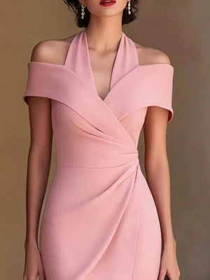 Pink asymmetrical midi dress with off-shoulder halter neckline and draped skirt.