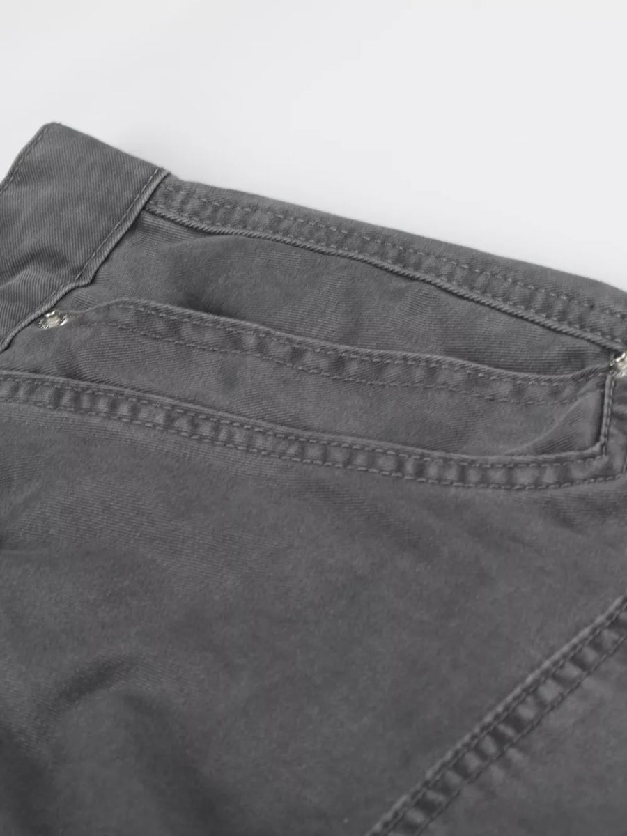 Men's grey cotton cargo capris with button closure and detailed stitching.
