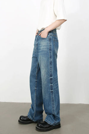 Baggy denim jeans in medium vintage wash with classic styling.
