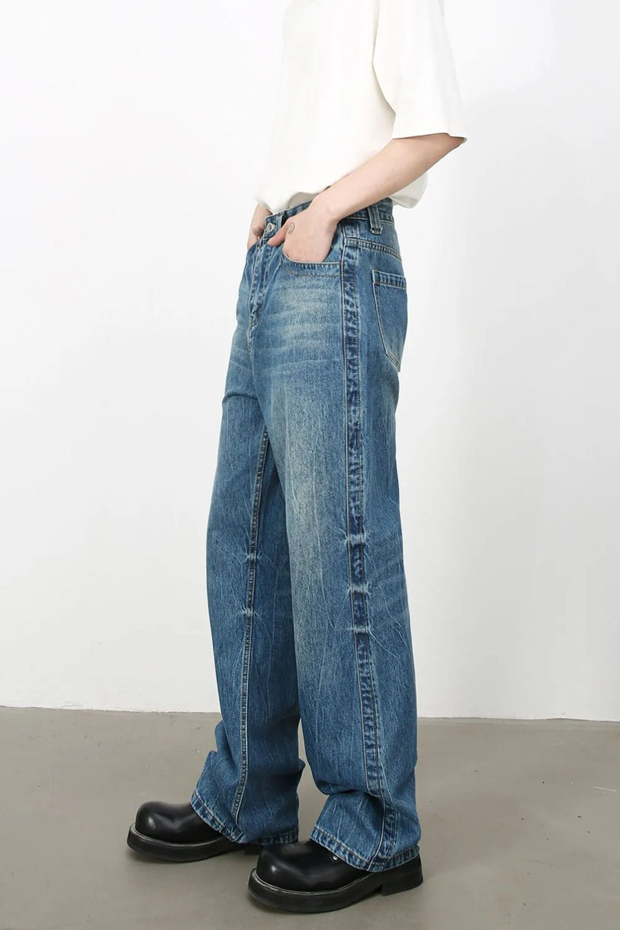 Baggy denim jeans in medium vintage wash with classic styling.