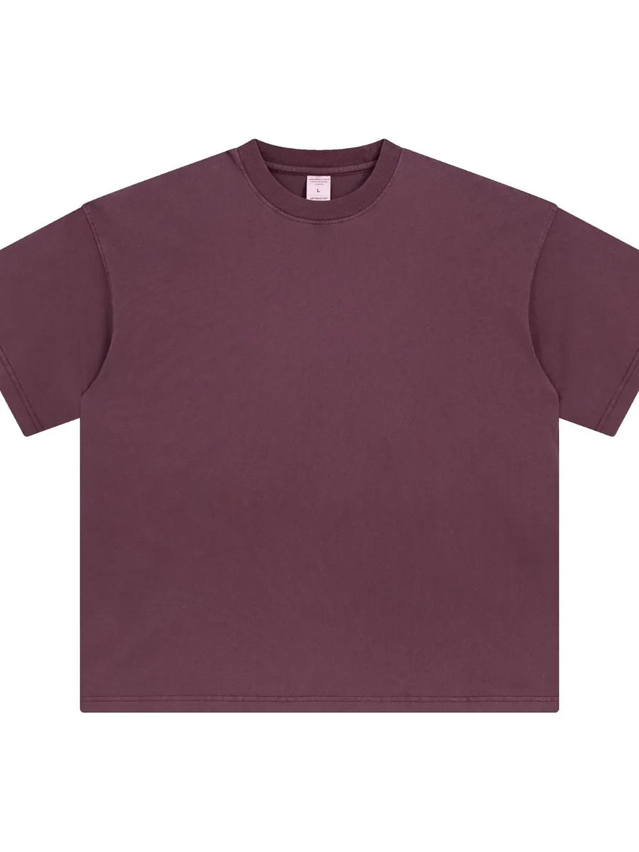 Oversized washed cotton crewneck t-shirt in plum purple with crew neckline and short sleeves.