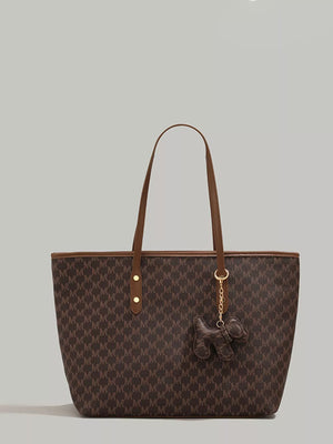 Brown monogram tote bag with dog charm and brown leather trim