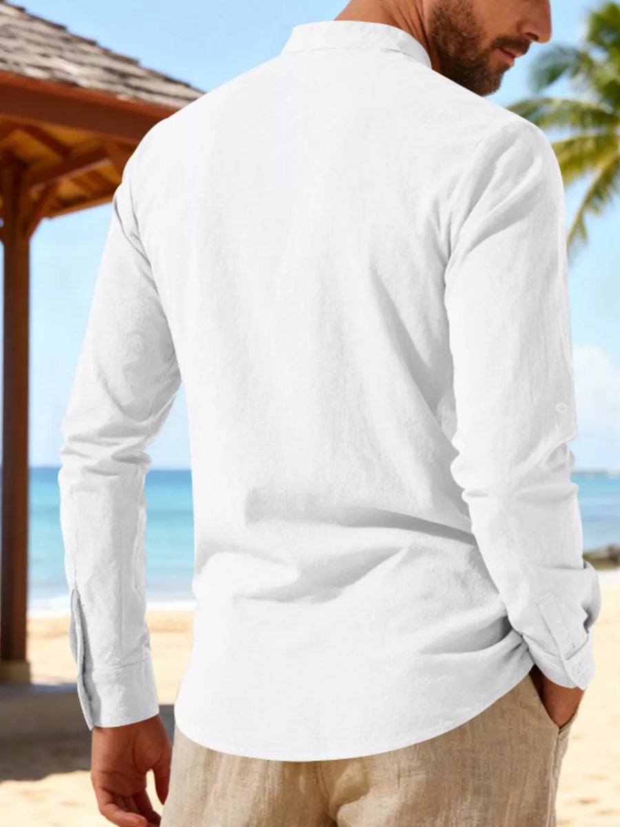 White linen long sleeve shirt with mandarin collar and button cuffs.