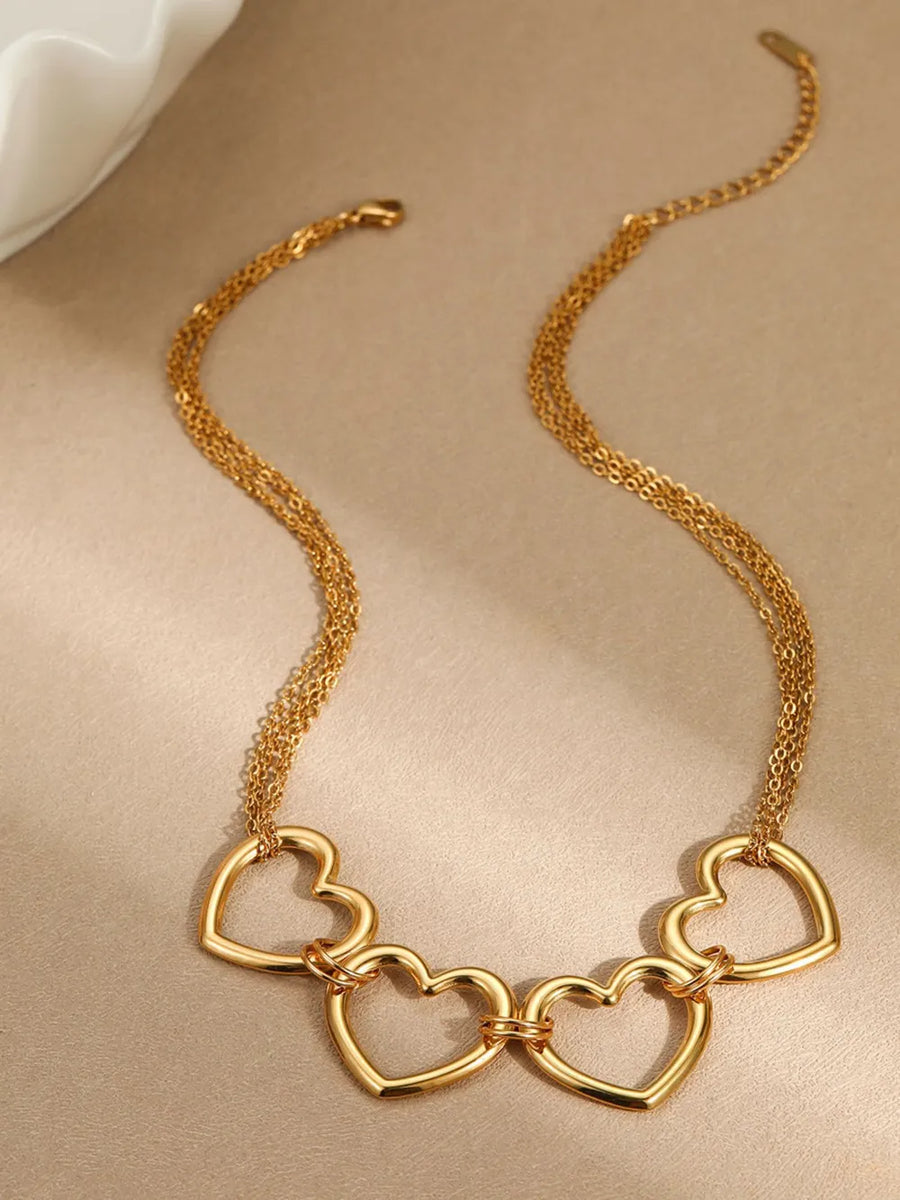 Gold necklace featuring heart motif and heart
