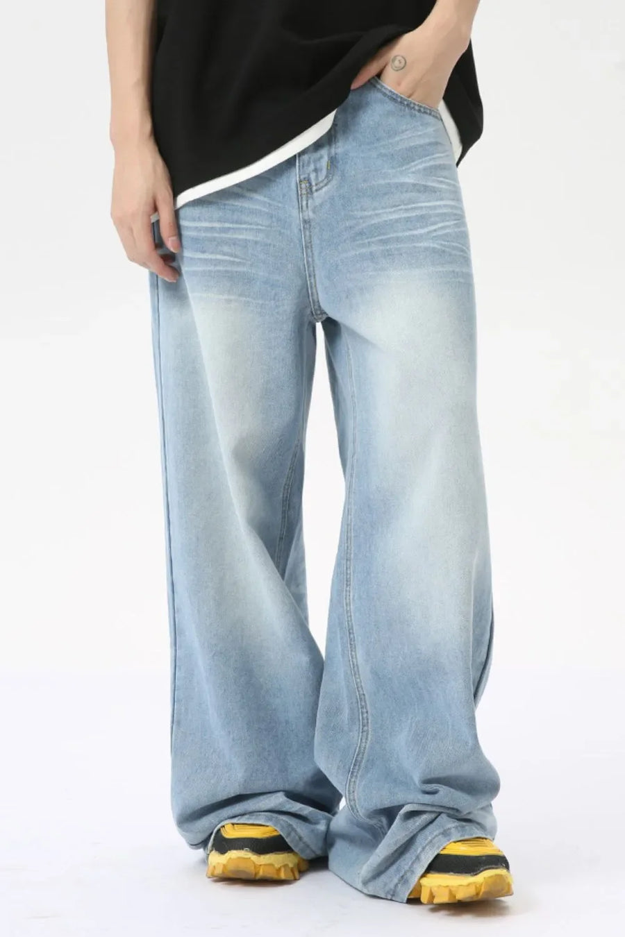 Oversized wash denim palazzo trousers in medium blue, featuring a relaxed fit and wide leg.
