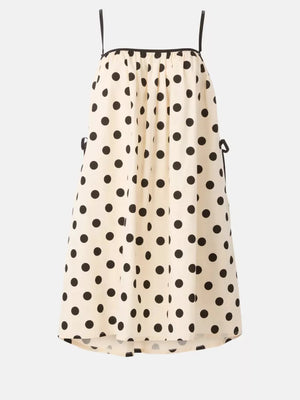 Cream polka dot midi dress with spaghetti straps and tie details