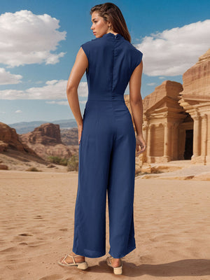 Dark blue wide-leg jumpsuit with draped neckline and cap sleeves.