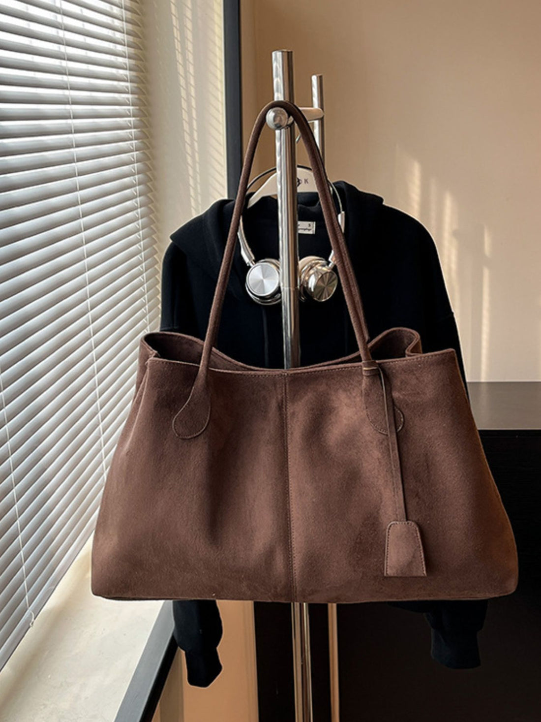 tote in chocolate brown featuring shoulder straps and relaxed fit