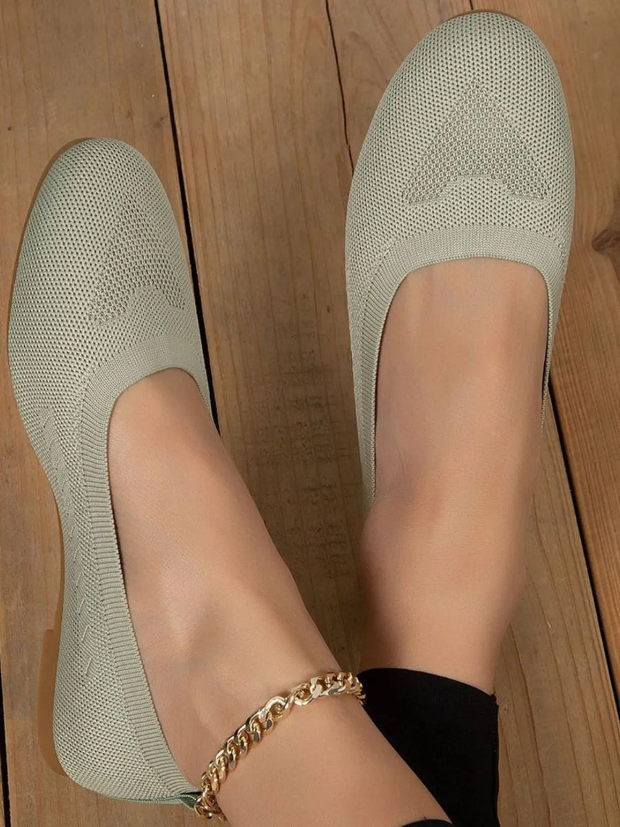 Sage knit ballet flats with subtle star detail, comfortable slip-on style.