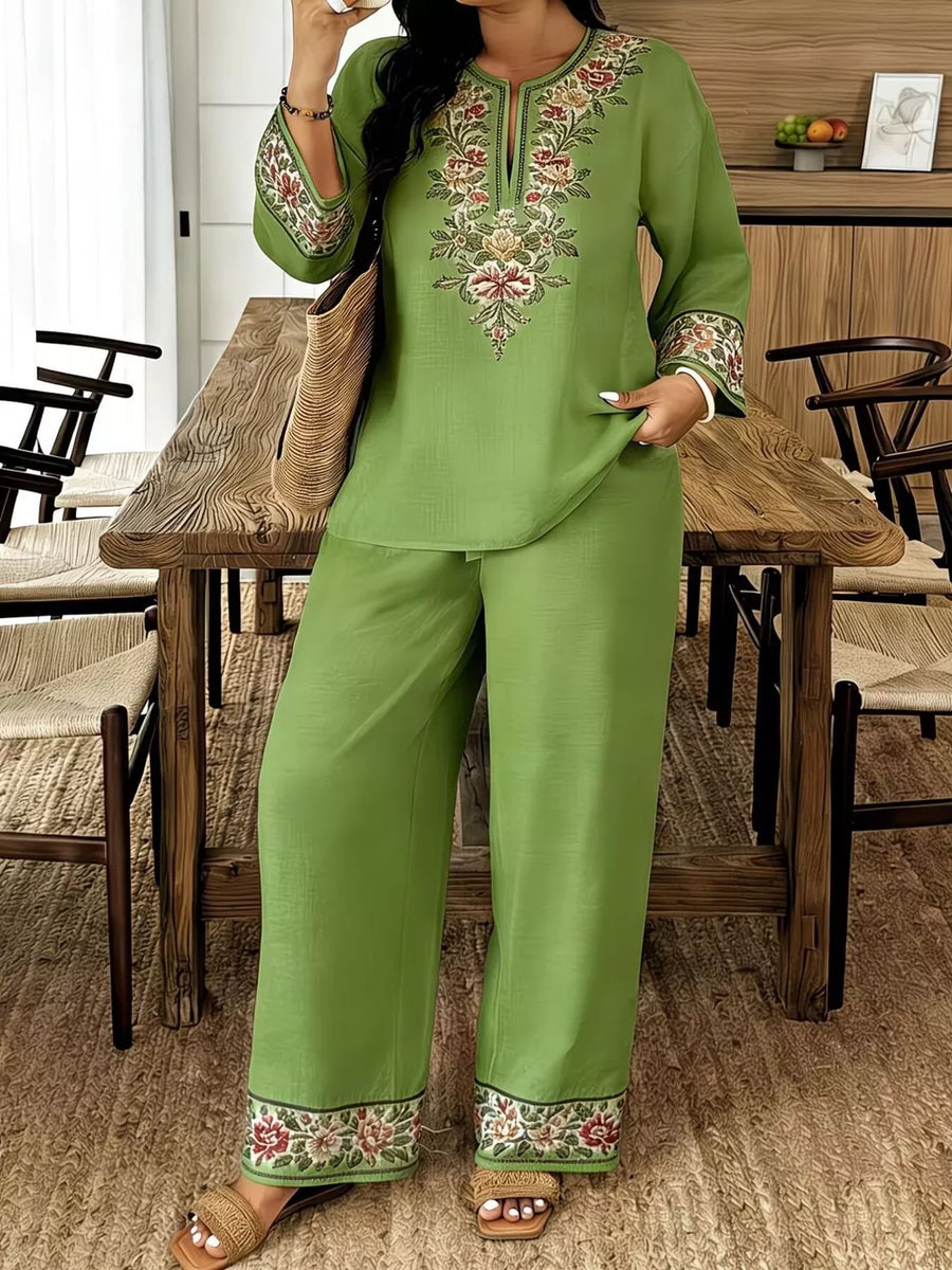 Green embroidered linen blend set with split neck tunic and wide leg pants.