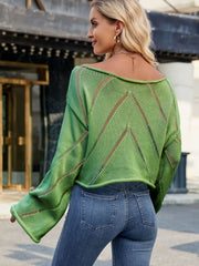 Green open-stitch chevron boat neck knit sweater with bell sleeves.