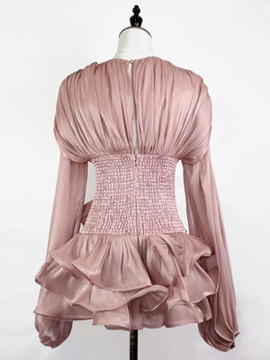 Pink ruffled mini dress with ruched corset waist and long sleeves