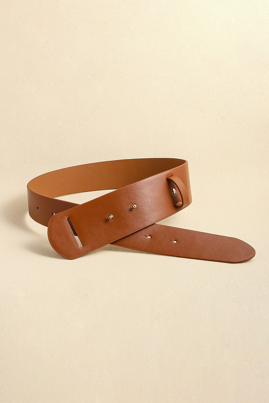 Sculpted leather waist belt in caramel with adjustable buckle detail.