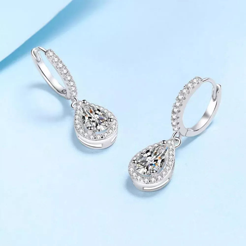 earrings in silver featuring moissanite stones and dangle fit