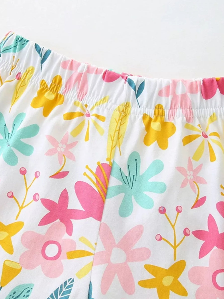 Toddler cotton blend shorts with elastic waist and colorful floral print.