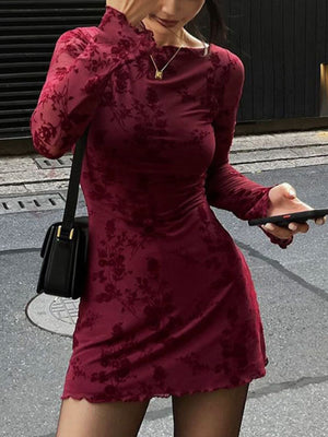 Burgundy floral mesh bodycon mini dress with long sleeves and lettuce hem.